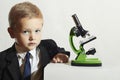 Little boy in tie. child.children.Schoolboy working with a microscope.Smart boy