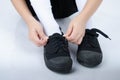 Little boy tie shoes ready for school on white background Royalty Free Stock Photo