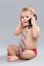 Little boy in tie speaks on a cell phone Royalty Free Stock Photo
