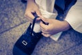 Little boy tightening shoelaces for himself Royalty Free Stock Photo