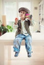 Little boy with a tin can telephone Royalty Free Stock Photo