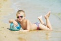 A little boy to take to the sea with the ball Royalty Free Stock Photo