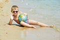 A little boy to take to the sea with the ball Royalty Free Stock Photo