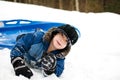 Little boy tobogganing Royalty Free Stock Photo