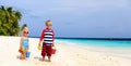 Little boy and toddler girl play with sand on Royalty Free Stock Photo