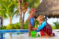 Little boy and toddler girl playing in swimming Royalty Free Stock Photo