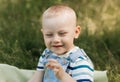 Little boy todler in nature in the summer. Portrait