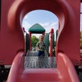Little boy at top of slide
