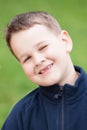 Little boy with a torn front first milk tooth