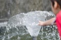 Little boy touching water the fountain Royalty Free Stock Photo