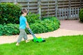 Little boy with toy lawn mower