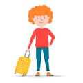 Little boy traveler stands, holding a suitcase on wheels. Ready to travel red hair teenager young man. Waiting for