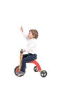 Little boy on tricycle pointing up Royalty Free Stock Photo