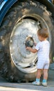 Little boy and truck wheel Royalty Free Stock Photo