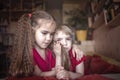 Little boy twirling her sisters beautiful hair in fingers to calm down, negative emotions Royalty Free Stock Photo