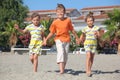 Little boy and two girls walking on beach Royalty Free Stock Photo