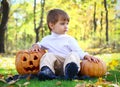 Little boy with two helloween pumpkins Royalty Free Stock Photo