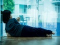 Little boy unhappy sad stitting in empty room and tress alone. Sad child concept. Royalty Free Stock Photo