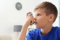 Little boy using asthma inhaler Royalty Free Stock Photo