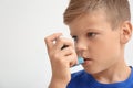 Little boy using asthma inhaler Royalty Free Stock Photo
