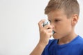 Little boy using asthma inhaler Royalty Free Stock Photo