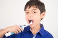 Little boy using electric toothbrushes dental healthcare on white background