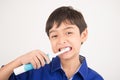 Little boy using electric toothbrushes dental healthcare on white background