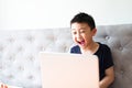 Little boy using laptop play game at home for relax Royalty Free Stock Photo