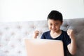 Little boy using laptop play game at home for relax Royalty Free Stock Photo