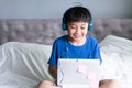 Little boy using laptop for play games Royalty Free Stock Photo