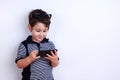 Little boy using mobile phone. Child playing on smartphone. Tech Royalty Free Stock Photo