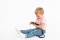 Little boy using mobile phone. Child playing on smartphone. Technology, mobile apps, children and parental advisory Royalty Free Stock Photo