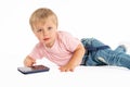 Little boy using mobile phone. Child playing on smartphone. Technology, mobile apps, children and parental advisory Royalty Free Stock Photo