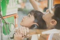 Little boy using public phone outdoor emergency call