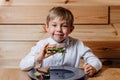 Little boy with vegetarian sandwich with whole grain bread Royalty Free Stock Photo