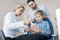 Little Boy Visiting Dentist with Dad Royalty Free Stock Photo