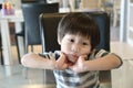 Little boy waiting for food in the restuarant