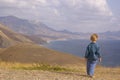 Little boy walk in summer mountain