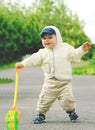 Little boy is walking along the street