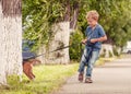 Little boy walking his puppy Royalty Free Stock Photo