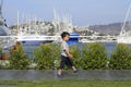 Little boy walking in a marina