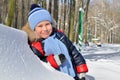 Little boy walking in snow-covered park in winter Royalty Free Stock Photo