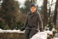 A little boy walks in the park in the winter weather, play snowballs and rejoiced. Waiting for Christmas mood Royalty Free Stock Photo