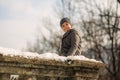 A little boy walks in the park in the winter weather, play snowballs and rejoiced. Waiting for Christmas mood Royalty Free Stock Photo