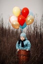 Little boy wants to fly on balloons Royalty Free Stock Photo