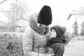 A little boy in a warm jacket and a winter hat. Black and white photo Royalty Free Stock Photo