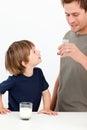 Little boy watching his father drinking milk Royalty Free Stock Photo