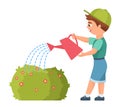 Little boy watering garden plant