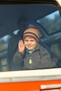 Little boy waving hand