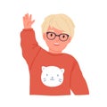 Little boy waving, smiling and saying hi or bye. Scandinavian child in eyewear gesturing with hand. Portrait of happy Royalty Free Stock Photo